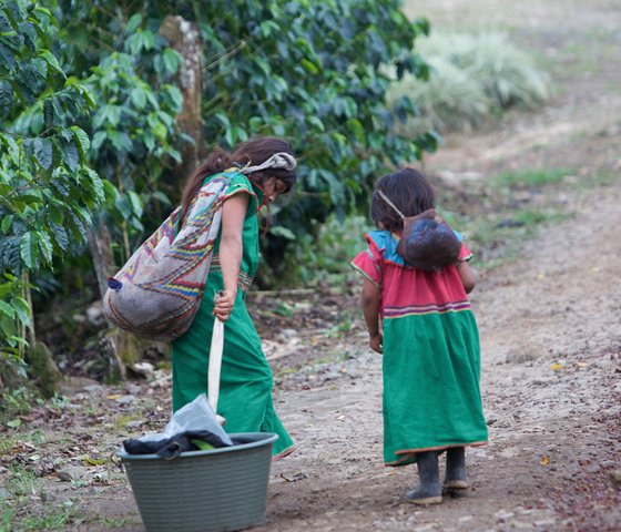 Little girls taking care of a baby